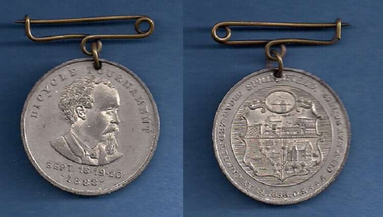1883 SPRINGFIELD, MASS. BICYCLE TOURNAMENT
35mm  -  White Metal
Storer 1638

The Obverse has a bust of H.H. Ducker.  
