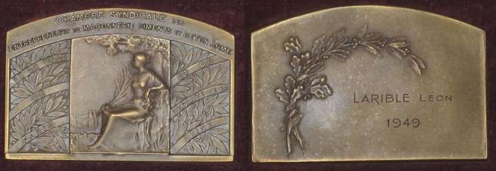 construction
Bronze panel ("bronze" struck on lower side, also exists silvered), width 7.6 cm, maximal height 5 cm, variant of a medal visible on this site at http://medals4trade.com/collections/displayimage.php?album=search&cat=0&pos=4, obverse showing seated female figure and inscribed "Chambre syndicale des Entrepreneurs de Maonnerie Ciments et Bton Arm" in top panel, "de la Ville de Paris" in left festoons and "et du Depart.t de la Seine" on right, signature R. Baudichon at lower right of central panel; very simple reverse with festoon and inscription "Lon Larible 1949"; this person's identity is undetermined.
Keywords: construction masonry cement