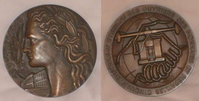 monnaies et mdailles
Bronze medal ("bronze" struck on edge)  7.3 cm, obverse with "1899 mai 1949", laureated female head and view of the Palais de la Monnaie, "atelier de gravure" inscribed at the foot of the neck of the figure, no other signature. Reverse bears the legend "Cinquantenaire du Syndicat des Ouvriers des Monnaies et Mdailles", also "CGT" (Confdration Gnrale du Travail) and "FSM" (Fdration syndicale mondiale), with medal press. Another medal was struck on the 80th anniversary.
Keywords: 1949 French_trade_unions